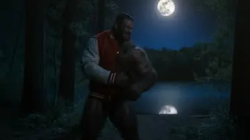 a realistic warewolf howling at a full moon, it is half man half wolf, super large muscles tear the seams of the clothing, the warewolf is wearing a letterman jacket in the deep mo